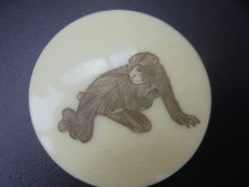 A lovely little trinket box possible made from bone with Monkey design.