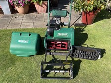 Qualcast Classic 35S Petrol mower with scarifier and aerator cassette.