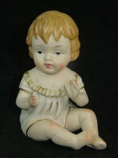 BISQUE PIANO BABY FIGURINE