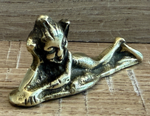 Vintage brass pixi laying down - brass,