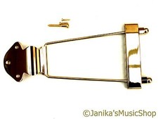 Gold trapeze tail piece