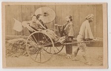 Japan CDV-two ladies with umbrella in a rickshaw