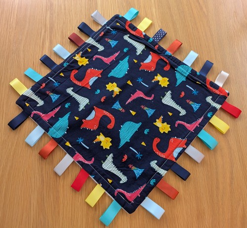 Bright coloured dinosaur taggy - bright,