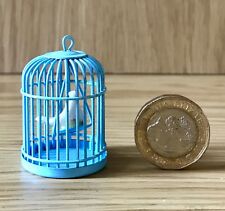 Lovely Doll House Blue Wire Bird Cage With A Swinging Bird On A Perch