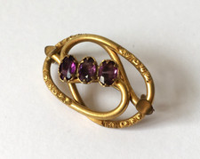 Victorian Pinchbeck Oval Brooch with row of three Amethysts
