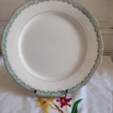 Longwy round serving dish in faience Trianon model green garland and gilding