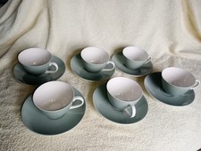 POOLE POTTERY CUPS AND SAUCERS