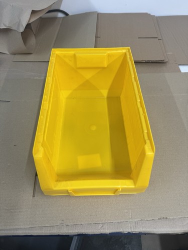 Yellow plastic part - part, bins