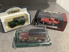 Three boxed model vans, cars, Shelby cobra, station wagon & Morris van.