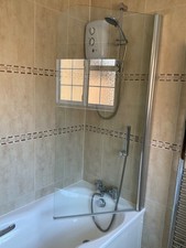 Novellini Aurora 6mm thick shower screen with satin finish wall bracket.