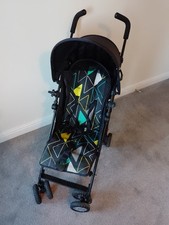 Mothercare black Nanu Stroller  with separate elements UV sunshade & raincover