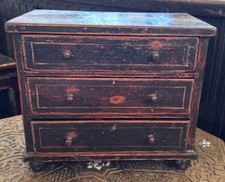 Early 19thc miniature ebonised pine chest of three drawers on bun feet