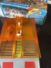 Vintage Matchbox Motorcity 6 Garage boxed and car wash boxed with 2 cars 
