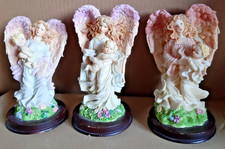 Vintage Collection 3 x Angels holding a baby statues/figurines on wood bases