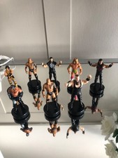 8x Wrestling Figurines Logo