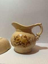 vintage bowl and water pitcher with flower