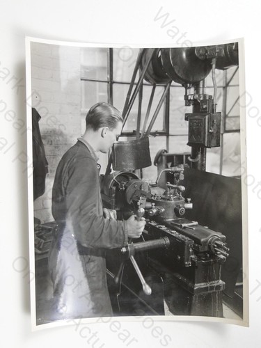 Young man machinist operating - young,