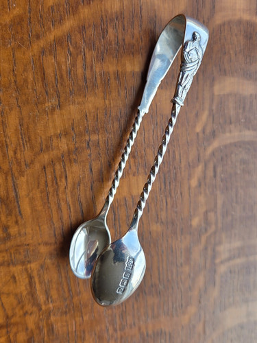 Silver apostle sugar tongs