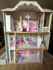 wooden Barbie doll house with elevator, dolls, car and furniture included