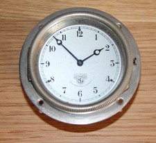 SMITHS VINTAGE CAR CLOCK. HINGED CASE. RUNS WELL