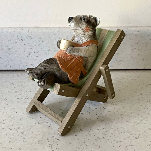 Otter figurine sitting deck - sitting, in