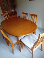 Extending Oval Dining Table and 6 Upholstered Chairs