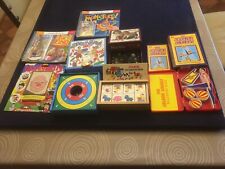 Bundle of games including marbles, tiddly winks, dominoes, amazing acrobat