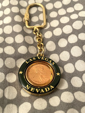 LAS VEGAS NEVADA SPINNING CENT COIN KEYRING GOLD BLACK COLOUR