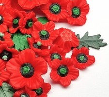 Poppy charms and glue on