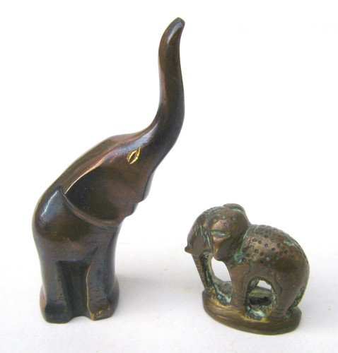 Two small solid metal - , elephant