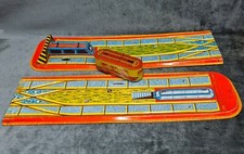 Early tinplate tram and 2
