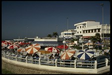 229010 Bright Umbrellas Mark A Popular Coastal Cafe A4 Photo Print