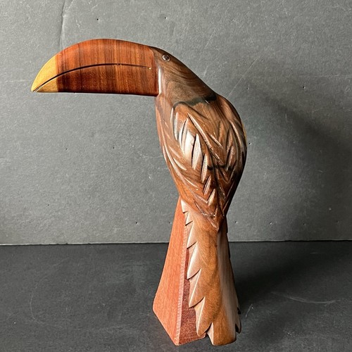 Hand carved wood toucan - hand,