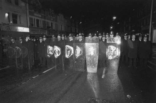 Police officers form wall - form,