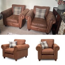 Pair of DFS brown Mossley Armchairs RRP £1100 collection only TW16 7LT 
