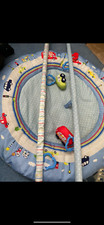  Playmat - on the road theme with Toy Arch From Mothercare . Lots of fun! 