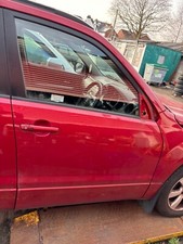 SUZUKI GRAND VITARA DRIVER'S FRONT DOOR IN RED METALLIC BREAKING CAR SPARES 2009