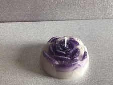 2 ROSE SHAPED CANDLES WITH GLITTERY FINISH