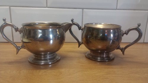 Silver plated milk jug and - milk,