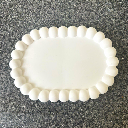 White off - white, oval