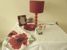 Red poppy ornaments, lamp, photo frame, table runner  etc.  Great condition 