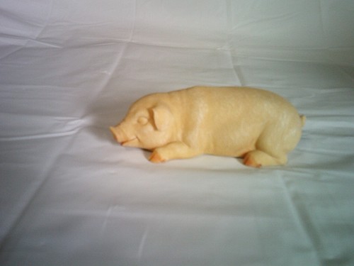 Small pig statue laying - statue, down