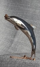 Silver Dolphin with gilded fish and rope base Saturno