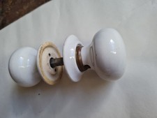 One pair of old/vintage Ceramic door handles/knobs with backplates 