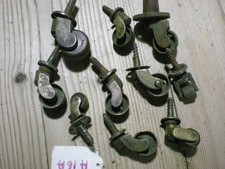 10 BRASS CASTORS  2 HAVE BROWN PORCLIAN CASTORS