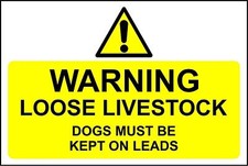 Warning loose livestock dogs