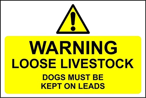 Warning loose livestock dogs