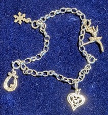 A sterling silver charm bracelet made in England