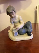 Nao Boy with Train Figurine