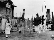 Woman handing out laundry